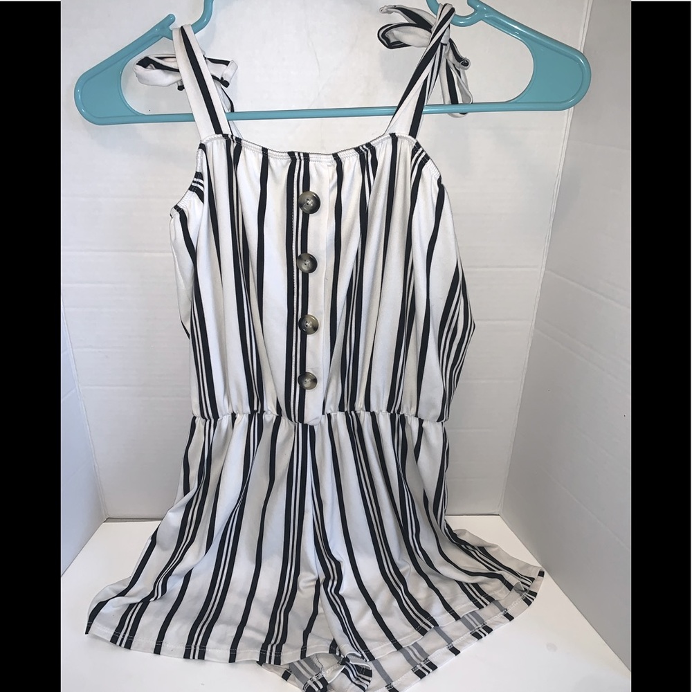 A cute black and white romper!Perfect for you but I would say this is for kids.